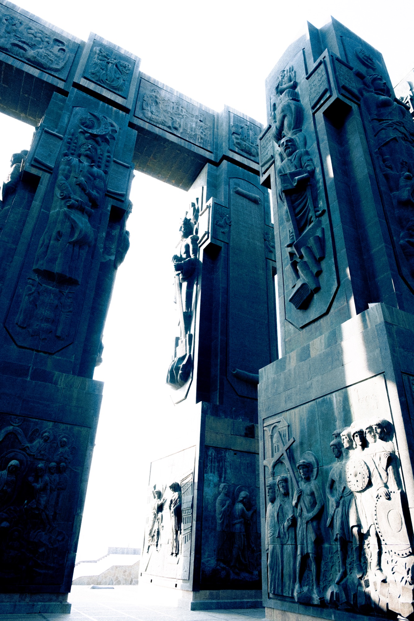 Monumental stone columns with relief sculptures