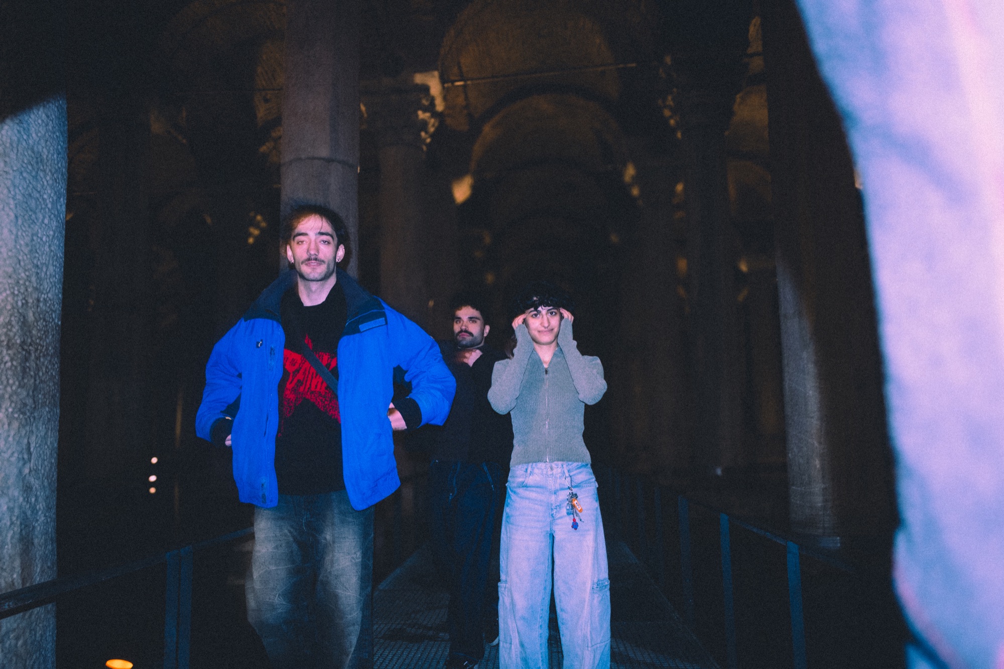 Group portrait in historical cistern, blue light